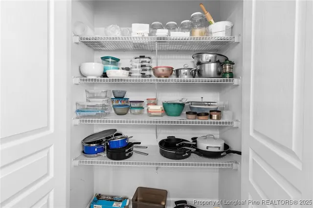 a kitchen with lots of bottles of alcohol