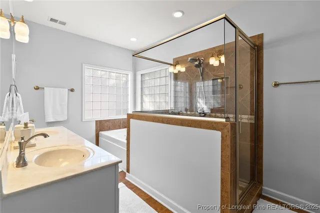 a bathroom with a bathtub and a shower