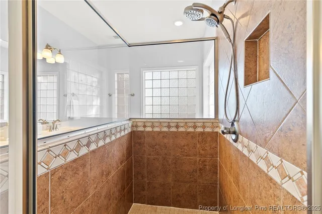 a bathroom with a sink a light fixture and a mirror