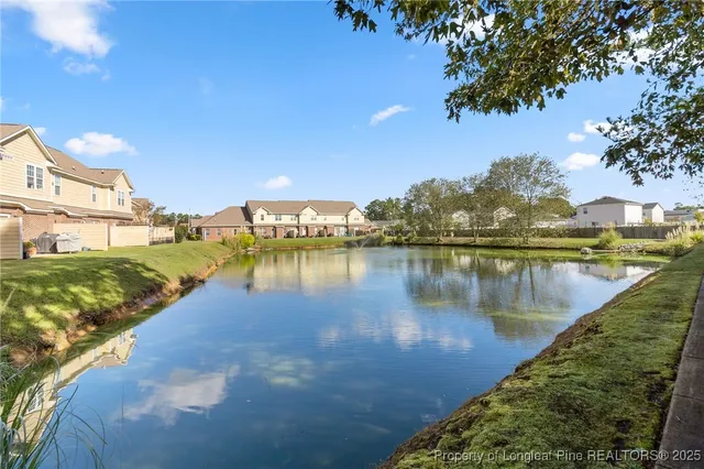a view of a house with backyard and a garden