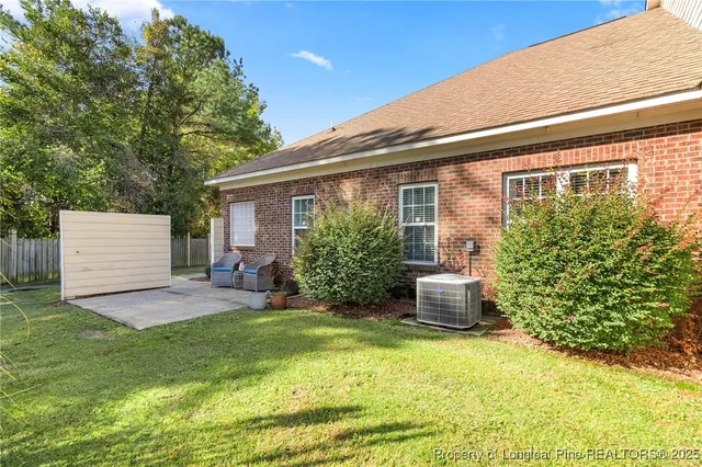 a view of a house with backyard porch and sitting area