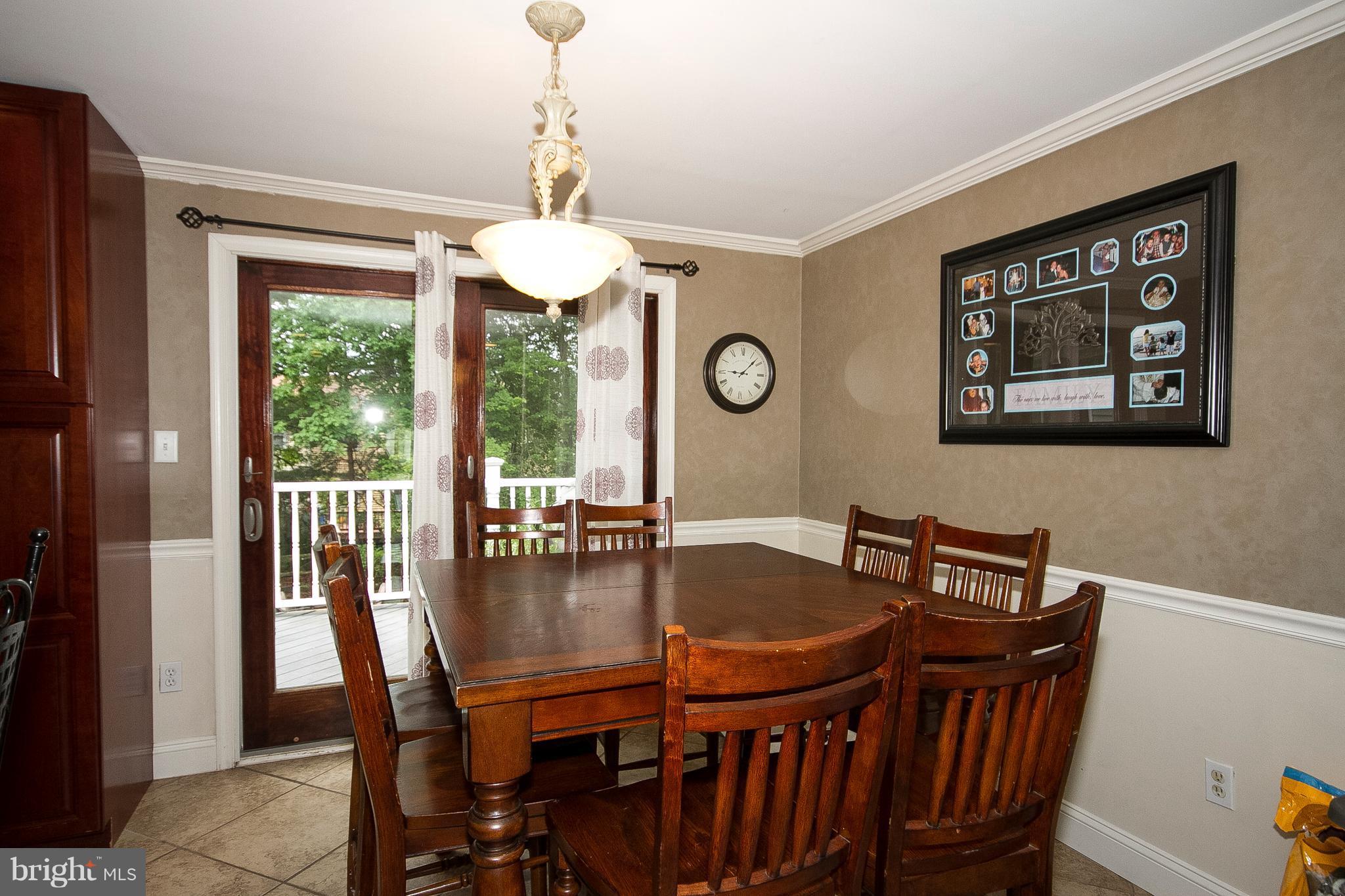4547 Ambermill Road Baltimore, MD 21236 - Photo 7 of 30 Dining room w/ chairrail and crown molding