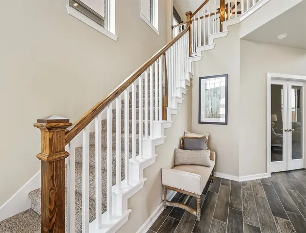 a room with stairs and furniture