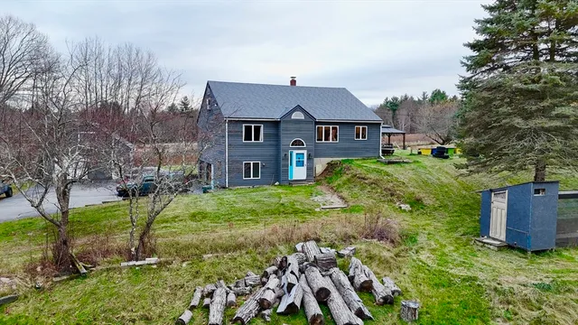 a front view of a house with a yard