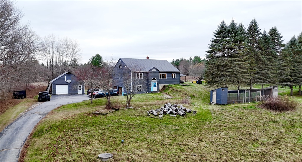 32 Hemlock Street Douglas, MA 01516 - Photo 2 of 11 a front view of a house with garden