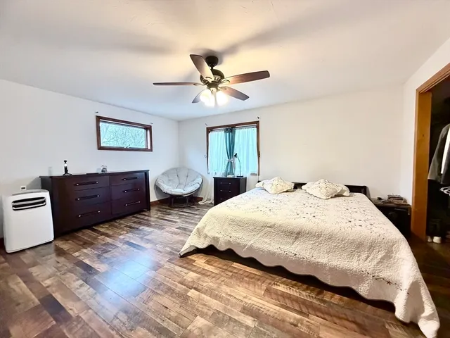a spacious bedroom with two beds and a chandelier
