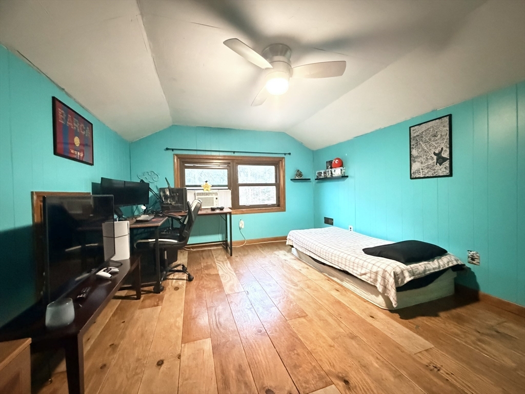 32 Hemlock Street Douglas, MA 01516 - Photo 9 of 11 a bed room with furniture and a flat screen tv