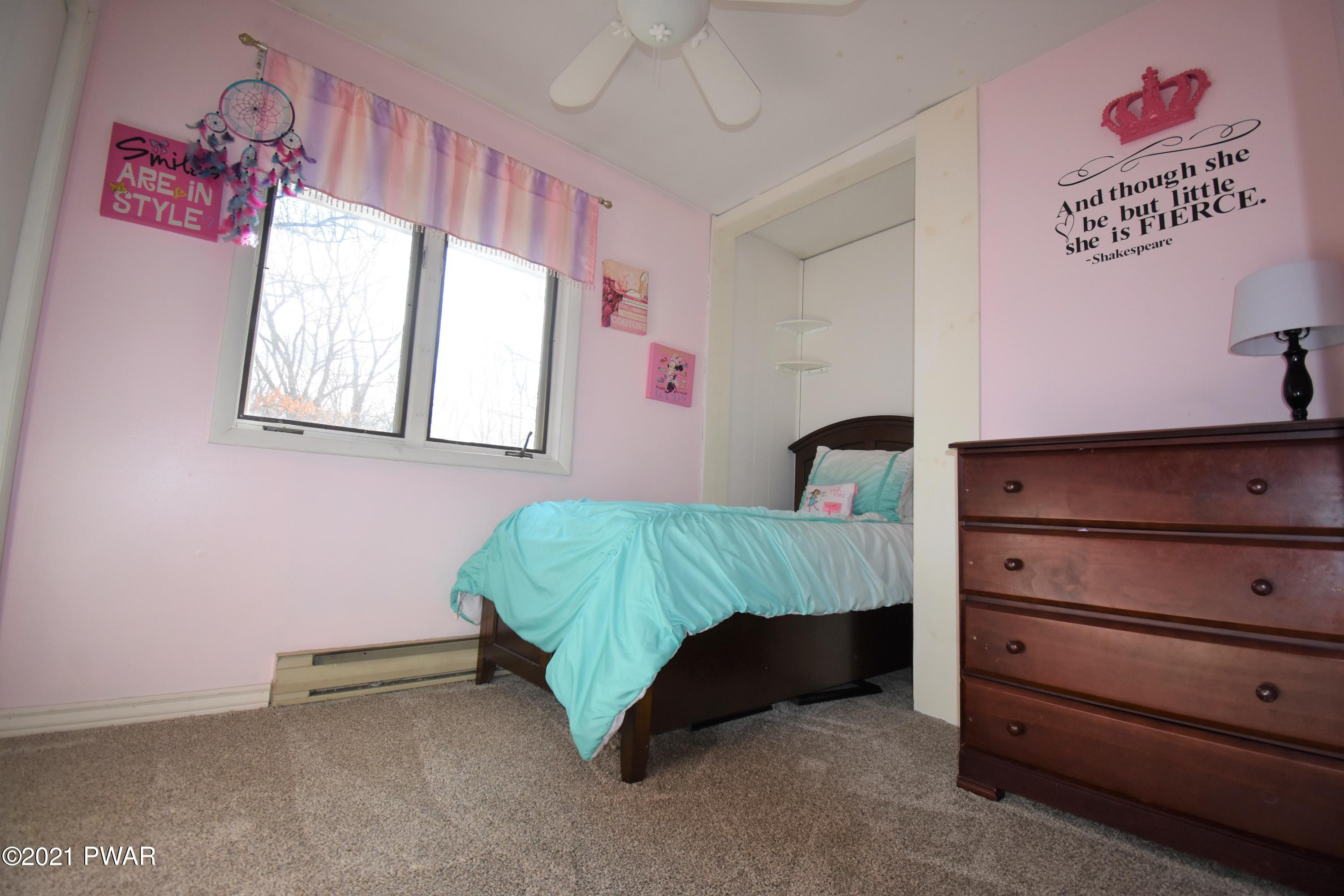 244 Fox Road Dingmans Ferry, PA 18328 - Photo 25 of 31 a bedroom with a bed and a window
