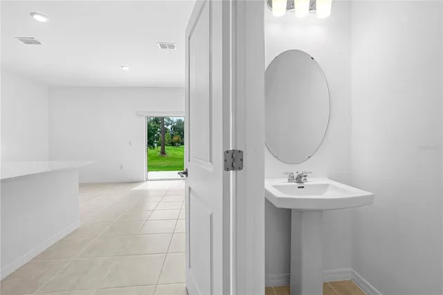 a bathroom with a sink a mirror and a toilet