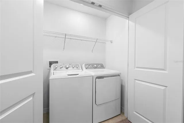 a utility room with dryer and washer