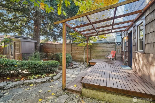 a view of backyard with sitting area