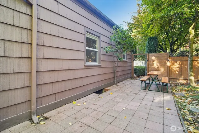 a view of backyard with sitting area