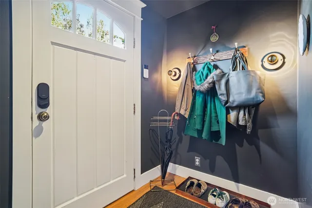 a view of an entryway with wooden floor