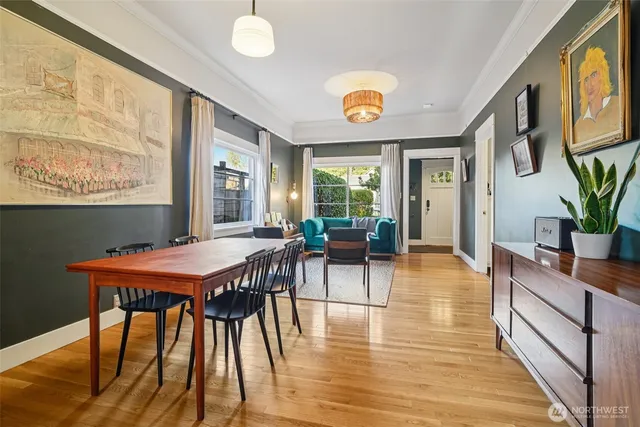 a view of a dining room with furniture and wooden floor