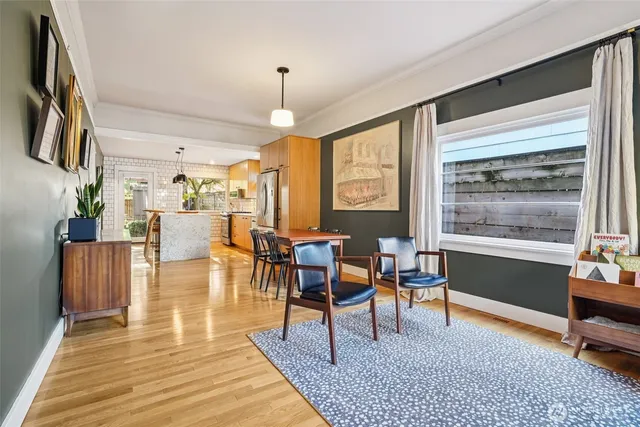 a living room with furniture a rug and a window