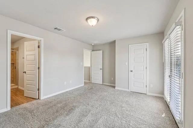 a view of an empty room and window