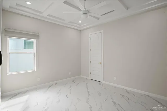 an empty room with windows and closet