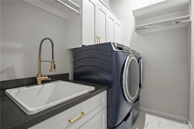 a spacious bathroom with a granite countertop sink a mirror and a bathtub