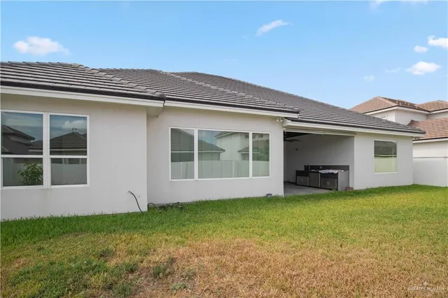 an aerial view of a house with a swimming pool