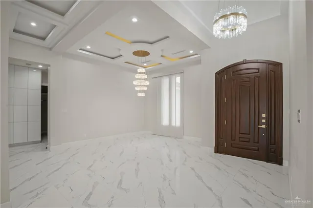 en empty room with windows and fan