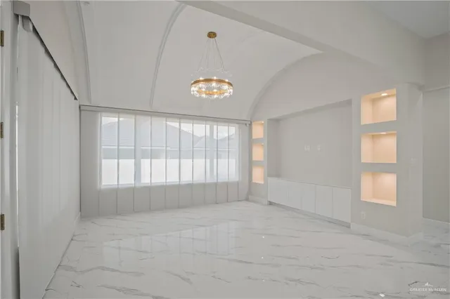 a kitchen with stainless steel appliances granite countertop a sink and cabinets