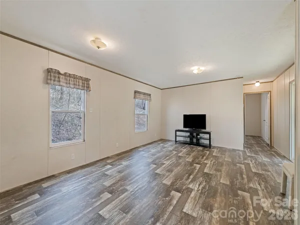 a kitchen with cabinets and white stainless steel appliances