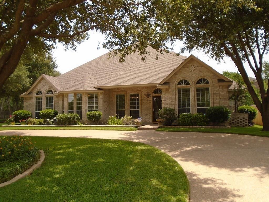 6905 Vista Ridge Court Fort Worth, TX 76132 - Photo 2 of 13 a front view of a house with a yard