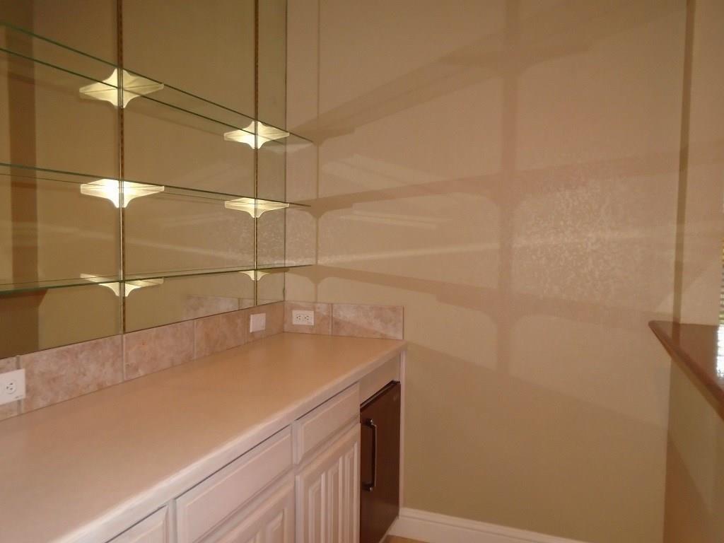 6905 Vista Ridge Court Fort Worth, TX 76132 - Photo 4 of 13 a bathroom with a sink and shower
