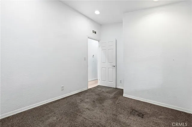 an empty room with an entryway door