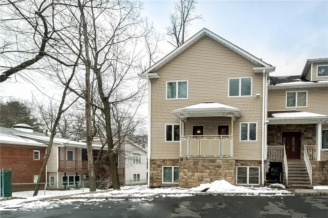 15 Howard Drive, Unit 1 Spring Valley, NY 10977 - Photo 1 of 1 a front view of a house with a yard