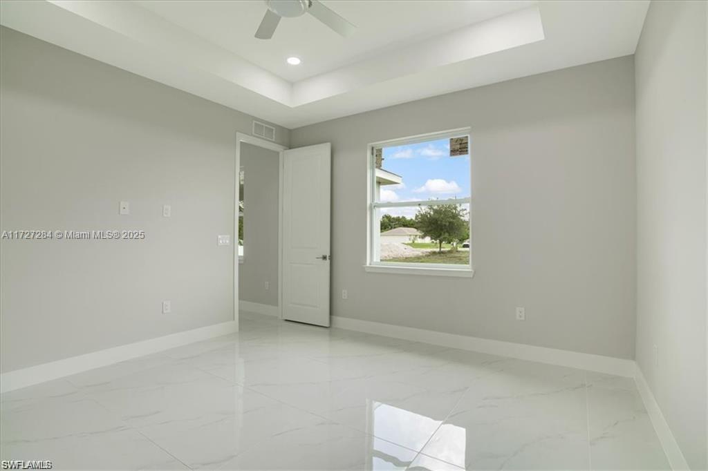 2902 49th Street Southwest Lehigh Acres, FL 33976 - Photo 16 of 26 a view of an empty room with a window