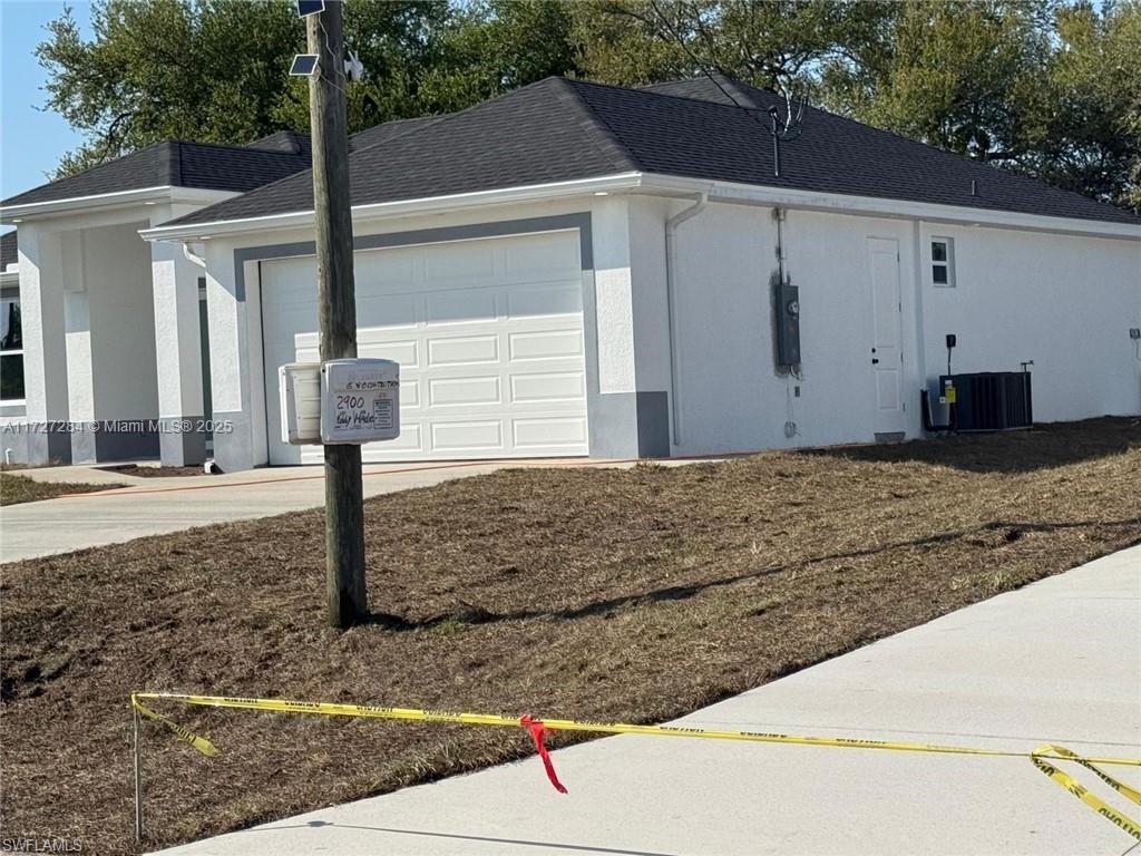2902 49th Street Southwest Lehigh Acres, FL 33976 - Photo 4 of 26 a front view of a house