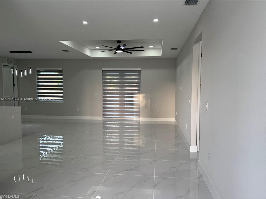 2902 49th Street Southwest Lehigh Acres, FL 33976 - Photo 6 of 26 a view of an empty room with a window