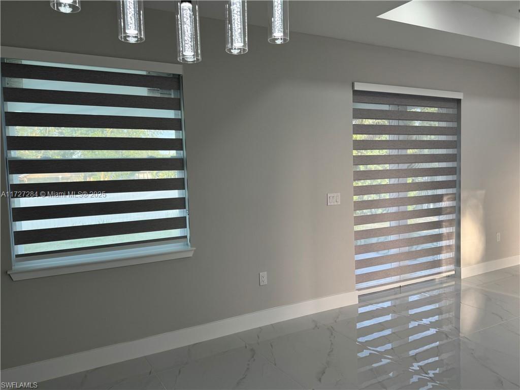 2902 49th Street Southwest Lehigh Acres, FL 33976 - Photo 8 of 26 a view of a room that has a window in the back