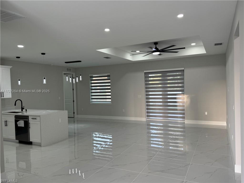 2902 49th Street Southwest Lehigh Acres, FL 33976 - Photo 9 of 26 a view of an empty room with a window