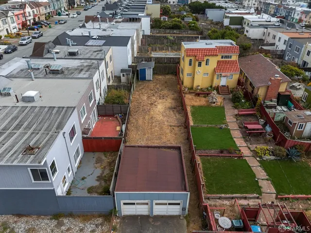 an aerial view of a house with a swimming pool