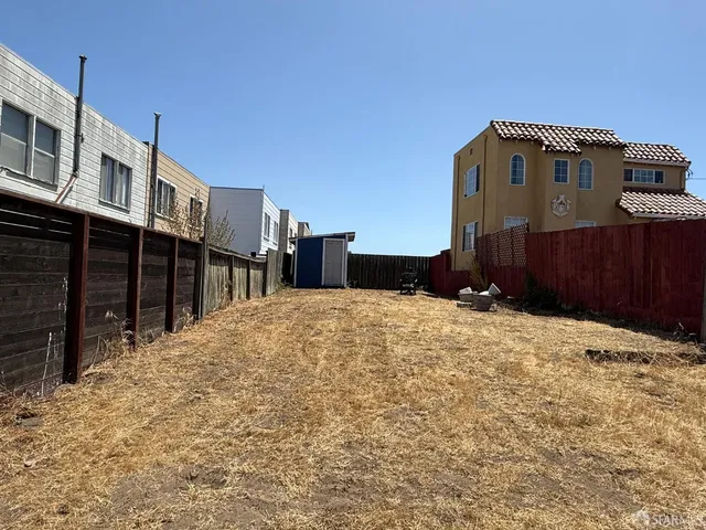 a view of a backyard of the house