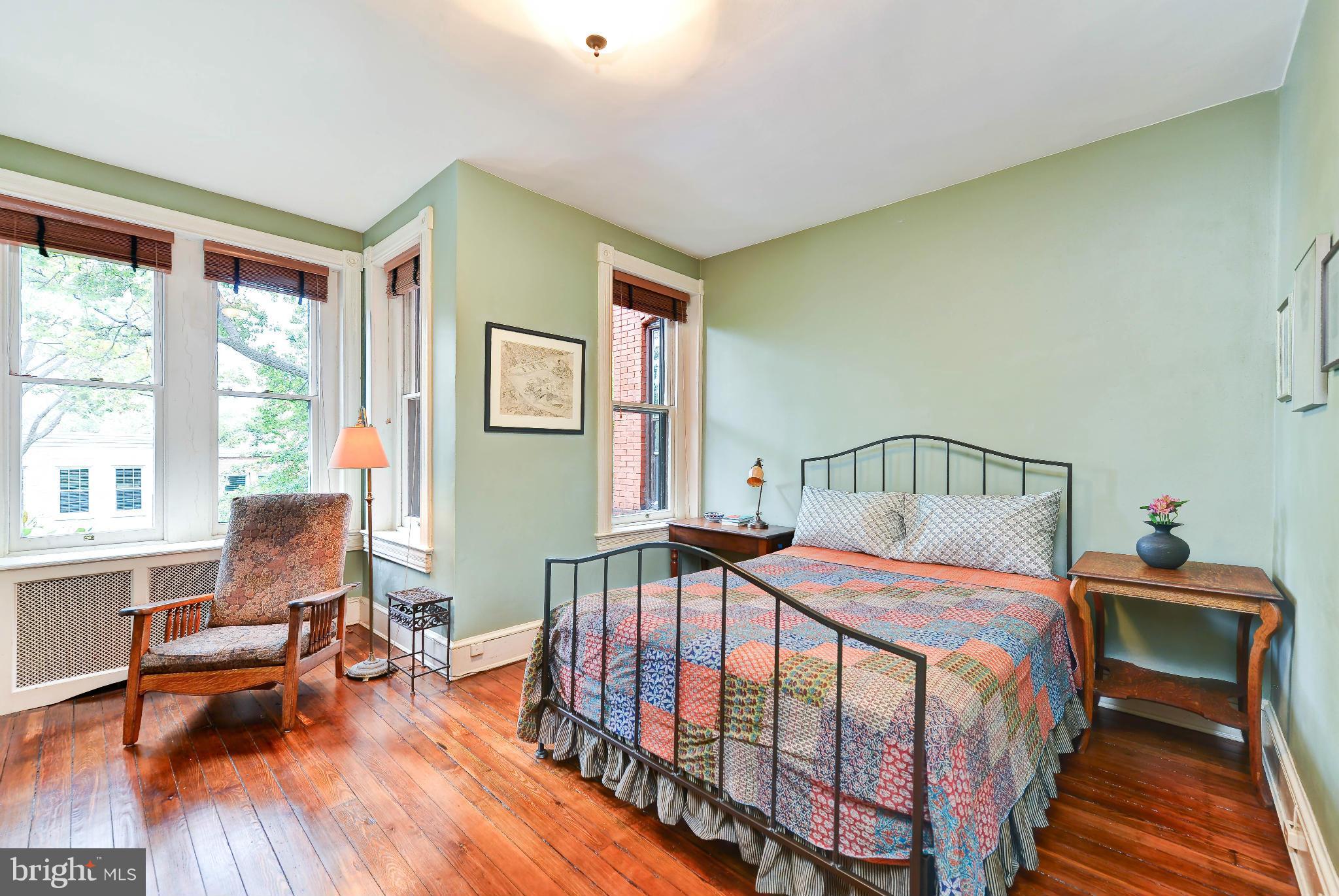 814 E Street Southeast Washington, DC 20003 - Photo 12 of 30 a bedroom with a bed and wooden floor