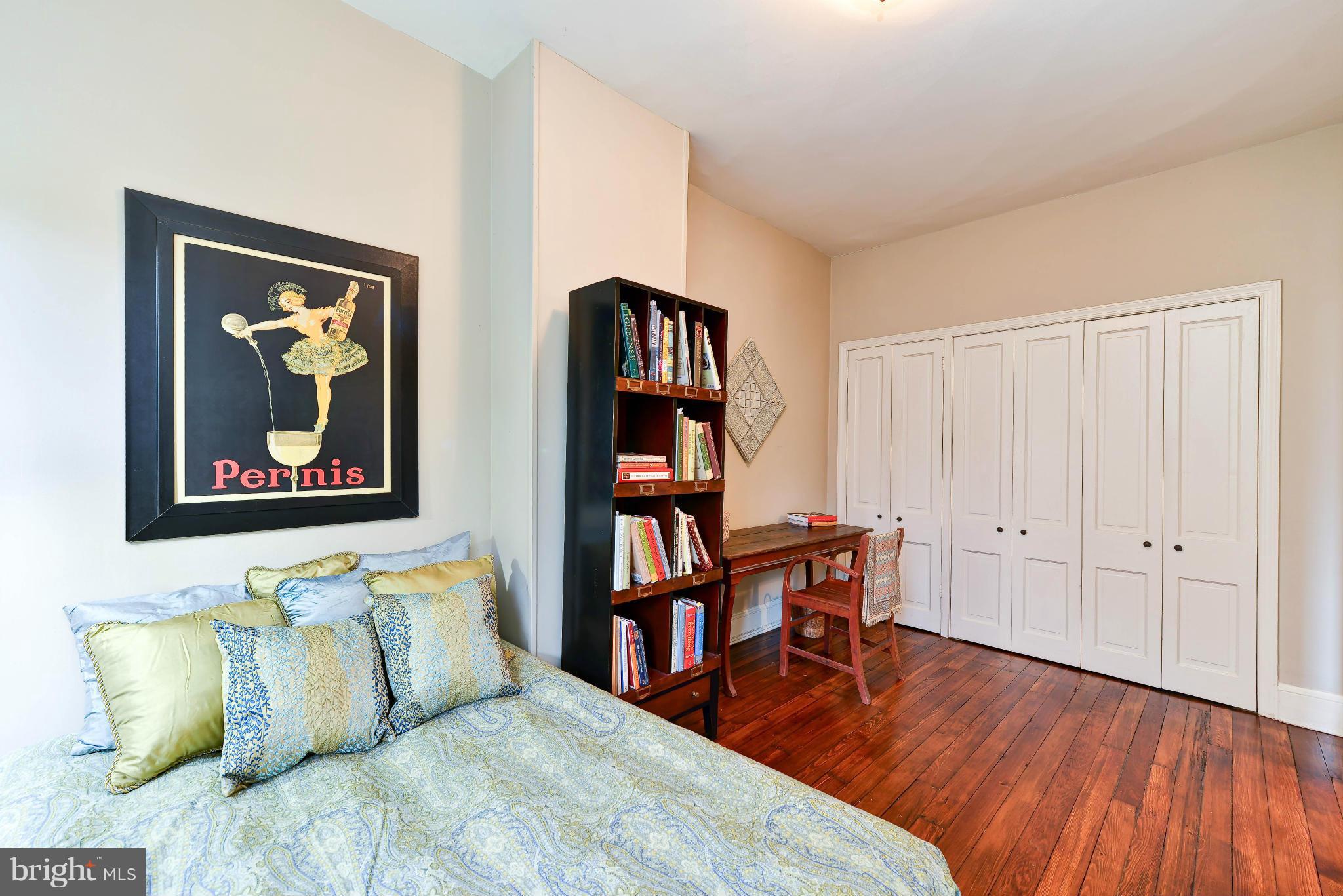 814 E Street Southeast Washington, DC 20003 - Photo 16 of 30 a bedroom with a bed and a book shelf