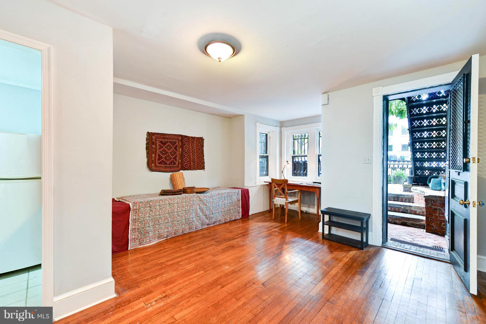 814 E Street Southeast Washington, DC 20003 - Photo 17 of 30 a living room with furniture and a wooden floor