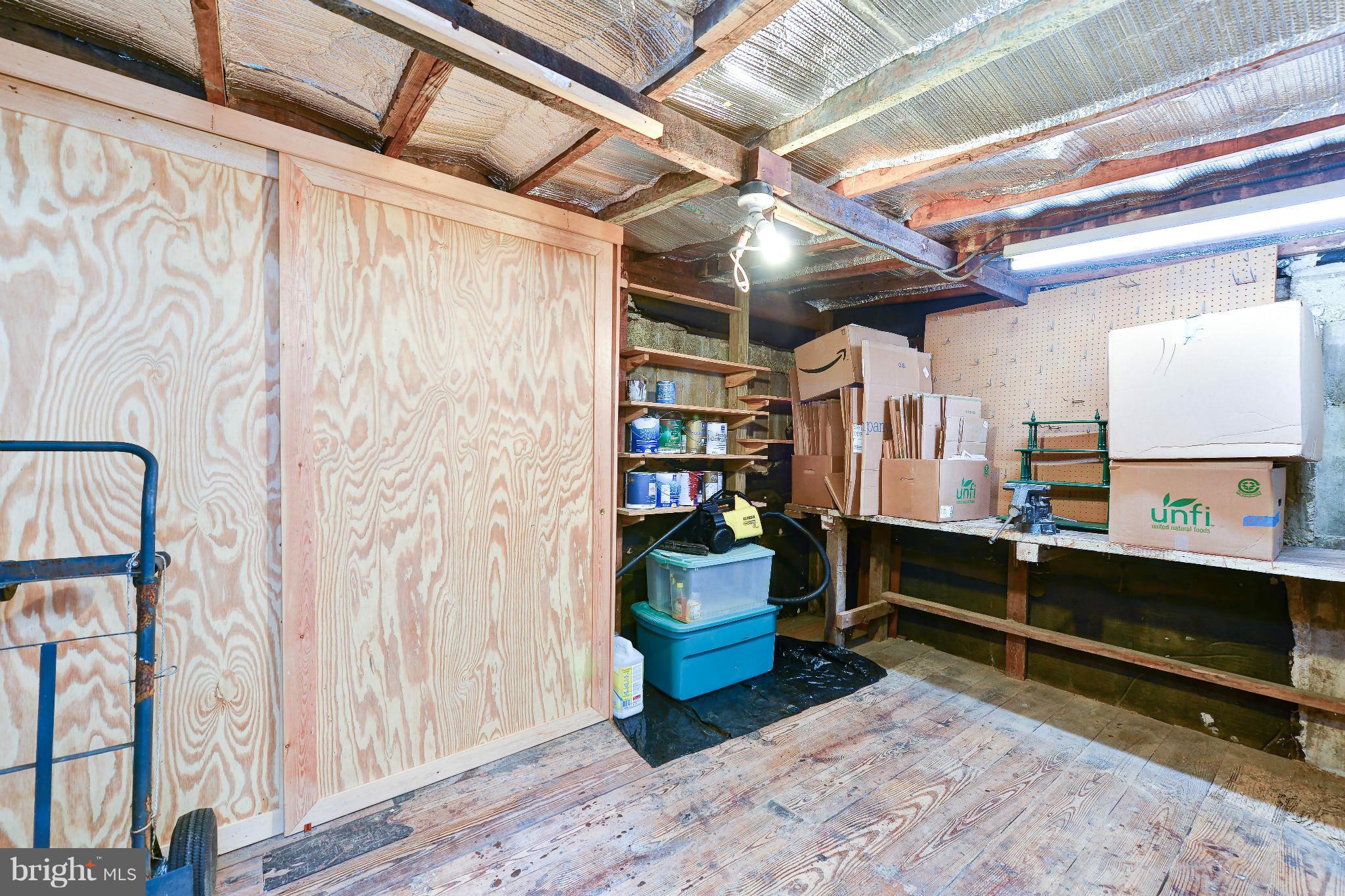 814 E Street Southeast Washington, DC 20003 - Photo 26 of 30 a room with lots of wooden furniture and a window