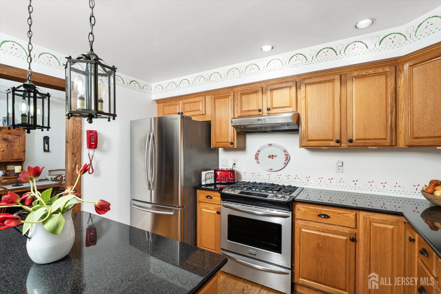 66 Rutgers Avenue Hamilton, NJ 08619 - Photo 12 of 31 a kitchen with stainless steel appliances granite countertop a refrigerator and a sink