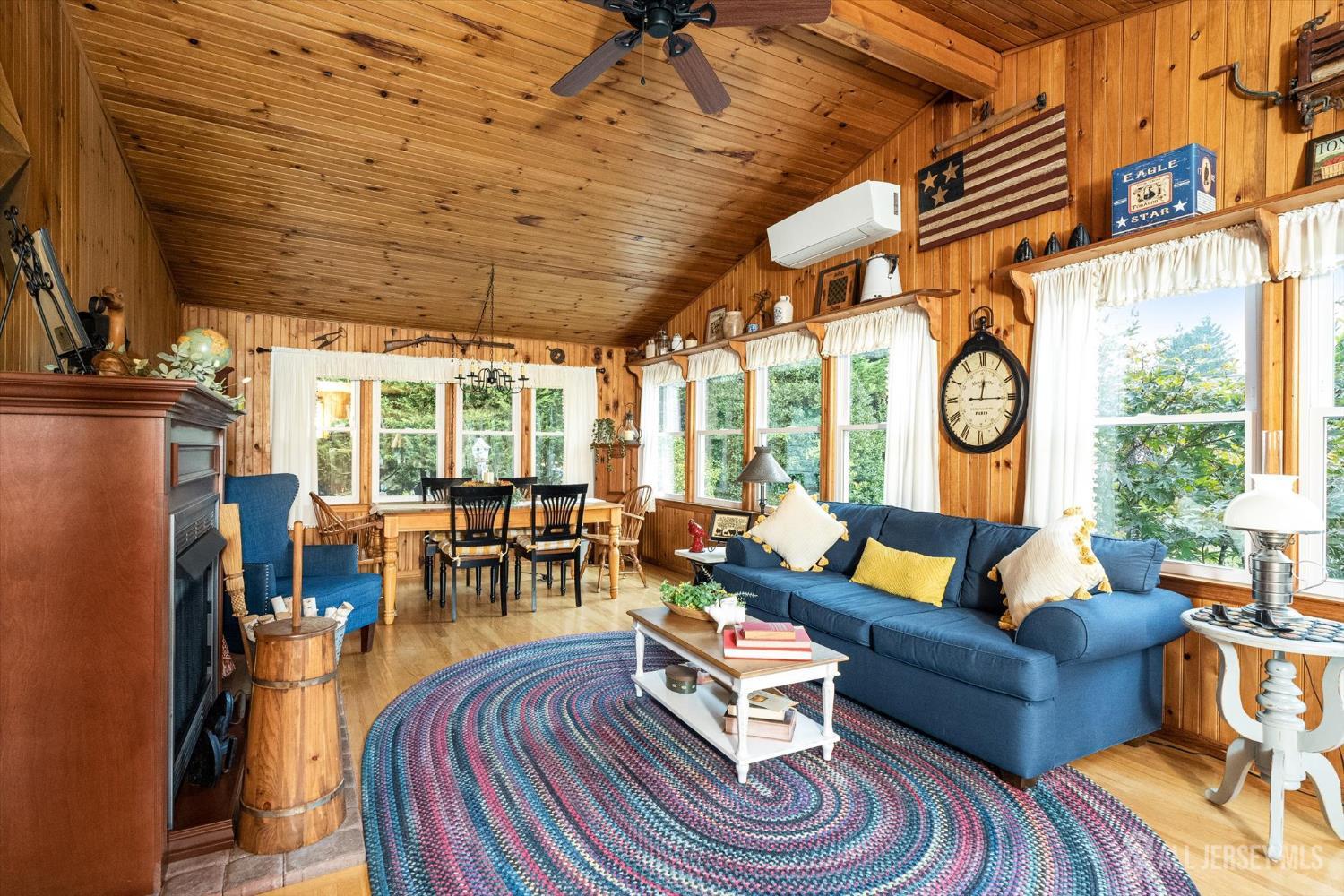 66 Rutgers Avenue Hamilton, NJ 08619 - Photo 13 of 31 a living room with furniture a rug a fireplace and a large window
