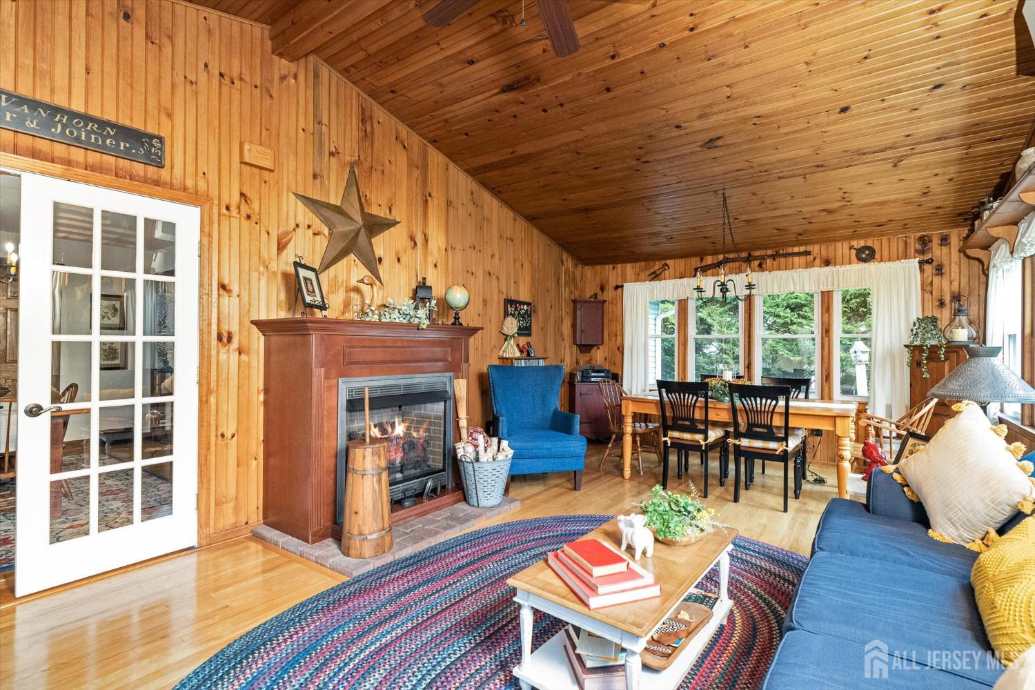 66 Rutgers Avenue Hamilton, NJ 08619 - Photo 14 of 31 a living room with furniture a fireplace and wooden floor