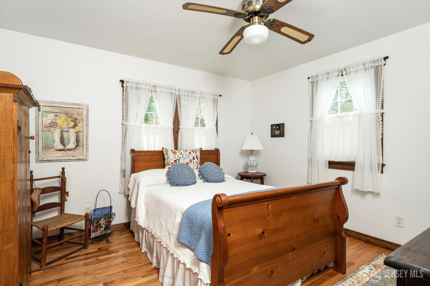 66 Rutgers Avenue Hamilton, NJ 08619 - Photo 20 of 31 a bedroom with a bed and wooden floor