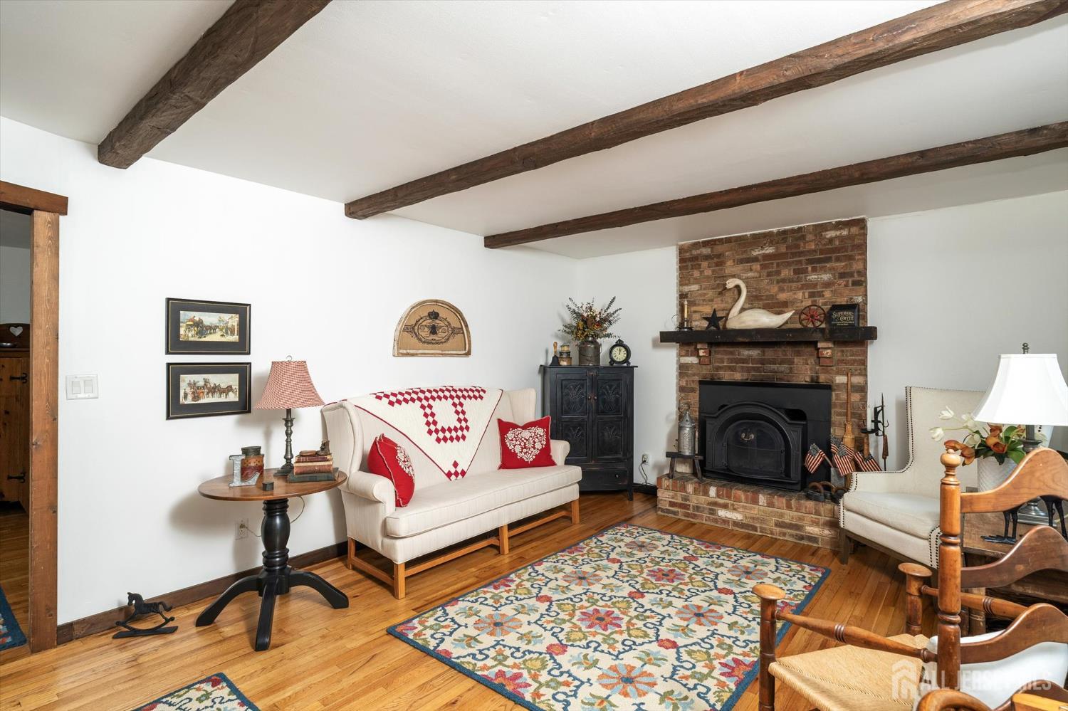 66 Rutgers Avenue Hamilton, NJ 08619 - Photo 4 of 31 a living room with furniture and a fireplace