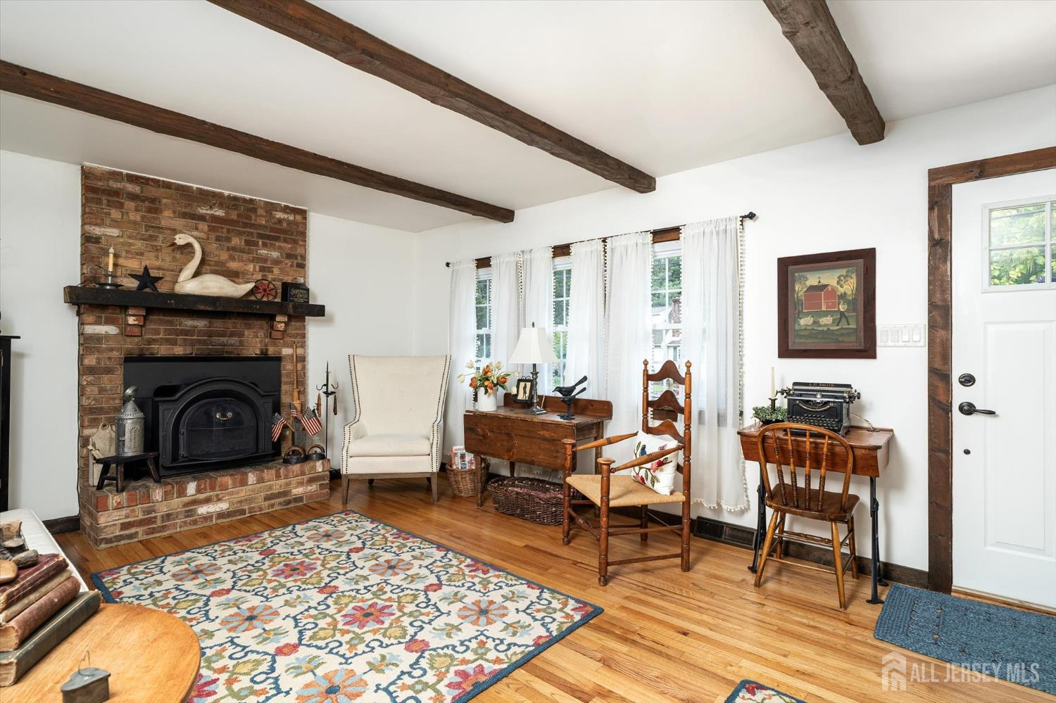 66 Rutgers Avenue Hamilton, NJ 08619 - Photo 5 of 31 a living room with furniture and a fireplace