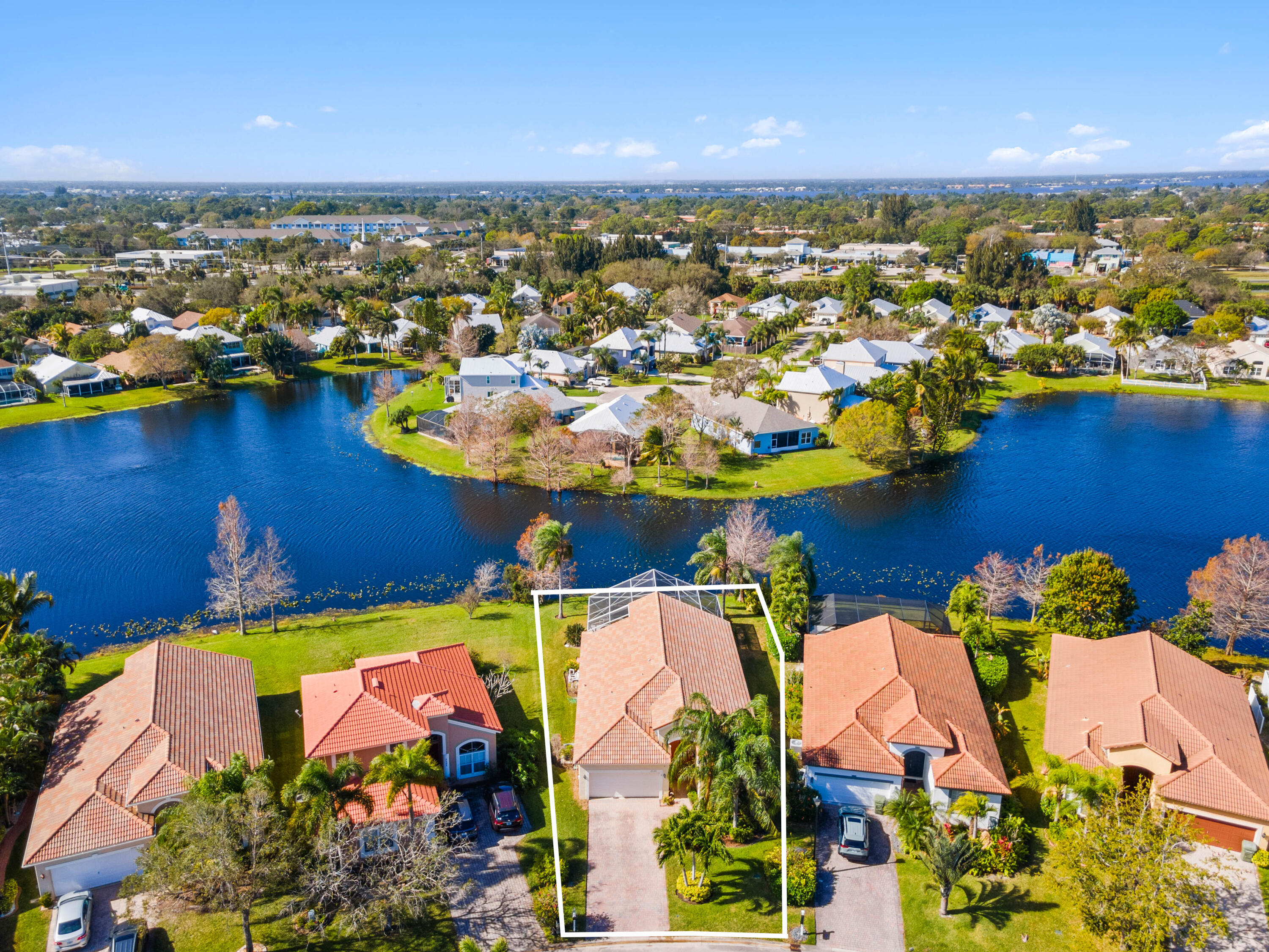 2096 Northwest Marsh Rabbit Lane Jensen Beach, FL 34957 - Photo 13 of 38 an aerial view of residential houses with outdoor space
