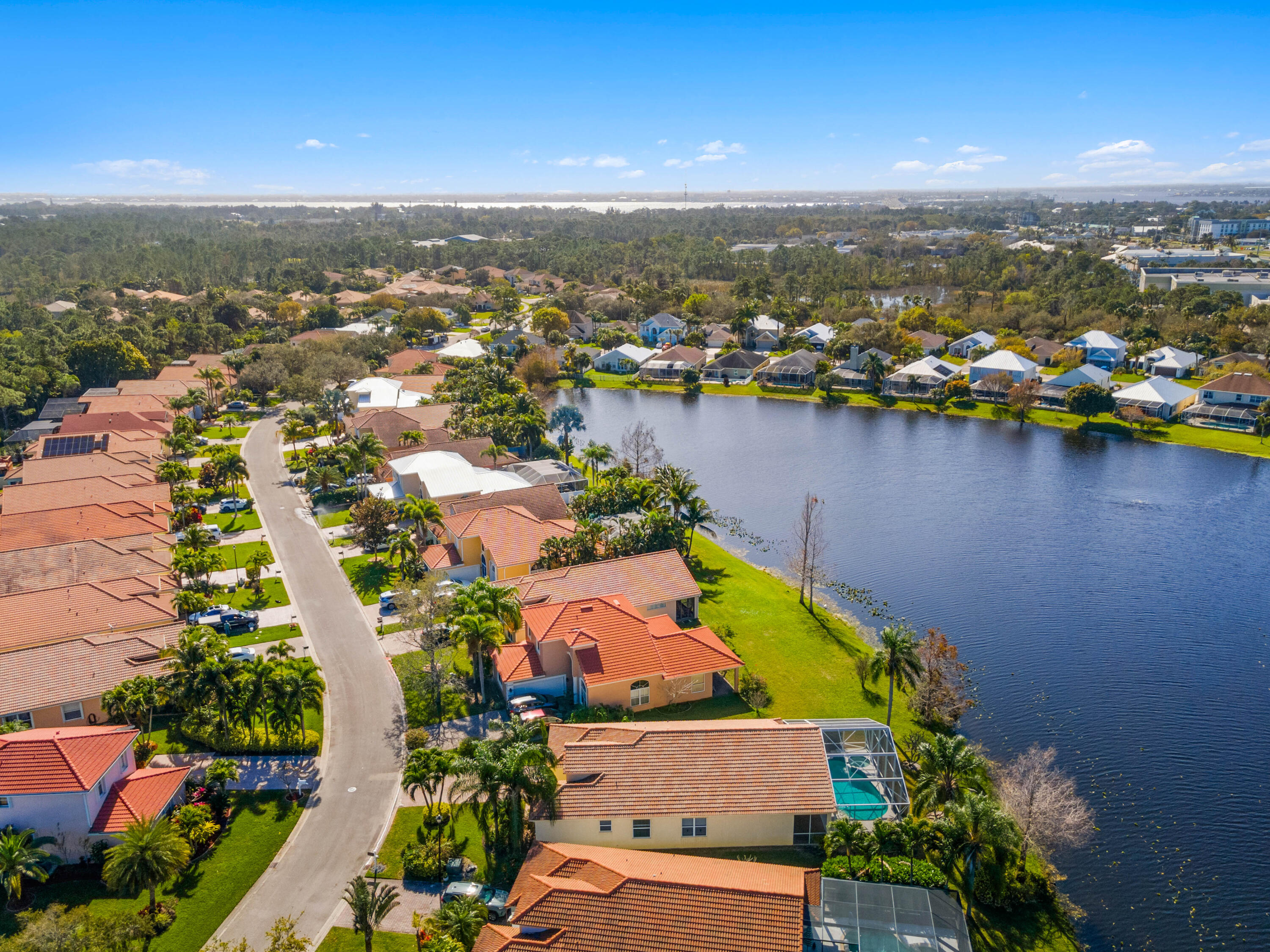 2096 Northwest Marsh Rabbit Lane Jensen Beach, FL 34957 - Photo 14 of 38 an aerial view of residential houses with outdoor space