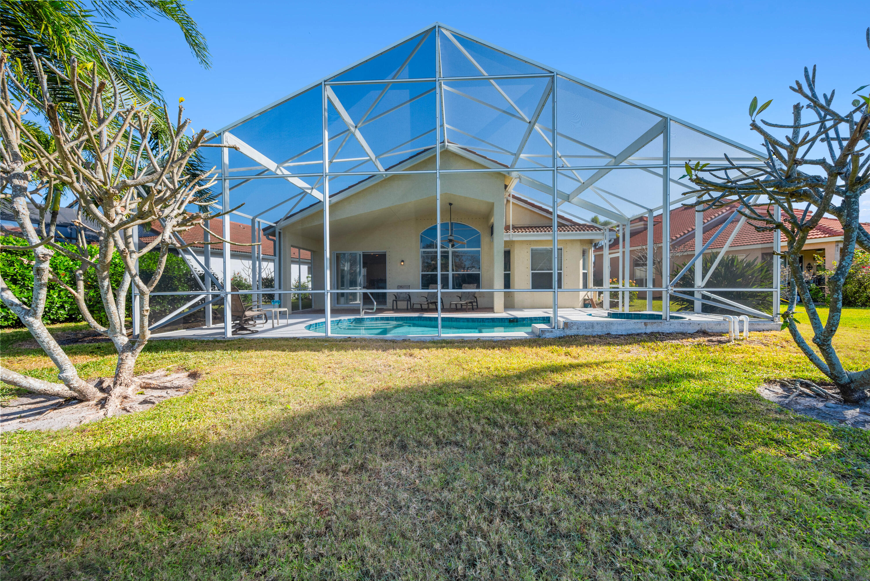 2096 Northwest Marsh Rabbit Lane Jensen Beach, FL 34957 - Photo 15 of 38 a view of a house with a backyard